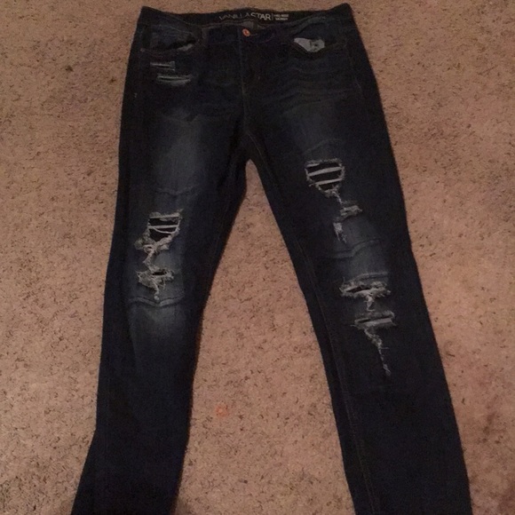 dark blue jeans with rips